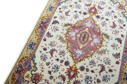 Backside of handmade 2000s Tabriz 50/60/70 Raj rug showing knot structure and weave density