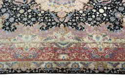 Corner detail of 2000s Tabriz 50/60/70 Raj rug showing border pattern and Cork pile