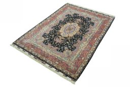 Corner detail of 2000s Tabriz 50/60/70 Raj rug showing border pattern and Cork pile