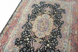 Backside of handmade 2000s Tabriz 50/60/70 Raj rug showing knot structure and weave density