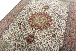 Backside of handmade New Tabriz 50/60/70 Raj rug showing knot structure and weave density