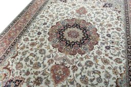 Backside of handmade New Tabriz 50/60/70 Raj rug showing knot structure and weave density