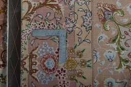 Backside of handmade New Tabriz 50/60/70 Raj rug showing knot structure and weave density