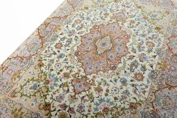 Backside of handmade New Tabriz 50/60/70 Raj rug showing knot structure and weave density