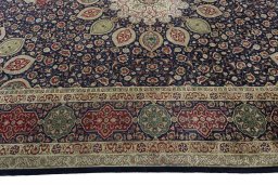 Corner detail of 1950s Tabriz 50/60/70 Raj rug showing border pattern and Cork pile