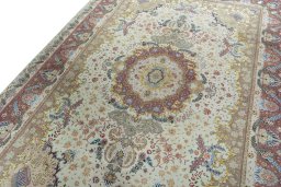Backside of handmade 2000s Tabriz 50/60/70 Raj rug showing knot structure and weave density