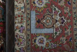 Backside of handmade New Tabriz 50/60/70 Raj rug showing knot structure and weave density