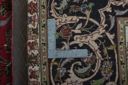 Backside of handmade 2000s Tabriz 50/60/70 Raj rug showing knot structure and weave density