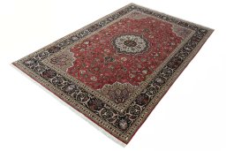 Corner detail of 2000s Tabriz 50/60/70 Raj rug showing border pattern and Cork pile