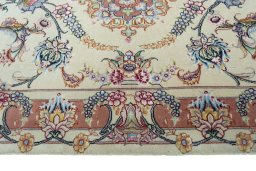 Corner detail of 2000s Tabriz 50/60/70 Raj rug showing border pattern and Cork pile