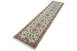Corner detail of 2000s Tabriz 50/60/70 Raj rug showing border pattern and Cork pile