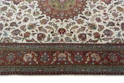 Corner detail of 2000s Tabriz 50/60/70 Raj rug showing border pattern and Cork pile