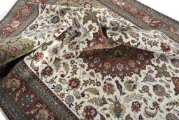 Surface texture of 2000s Tabriz 50/60/70 Raj rug with natural Cork and intricate pattern
