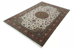 Corner detail of 2000s Tabriz 50/60/70 Raj rug showing border pattern and Cork pile
