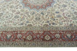 Corner detail of 2000s Tabriz 50/60/70 Raj rug showing border pattern and Cork pile