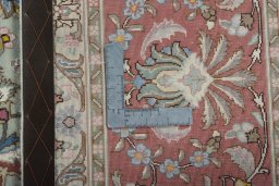 Backside of handmade 2000s Tabriz 50/60/70 Raj rug showing knot structure and weave density