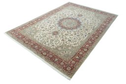 Corner detail of 2000s Tabriz 50/60/70 Raj rug showing border pattern and Cork pile