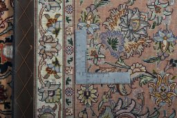 Backside of handmade New Tabriz 50/60/70 Raj rug showing knot structure and weave density
