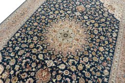 Backside of handmade New Tabriz 50/60/70 Raj rug showing knot structure and weave density