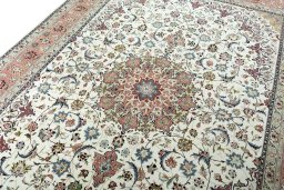 Backside of handmade New Tabriz 50/60/70 Raj rug showing knot structure and weave density