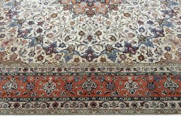 Corner detail of New Tabriz 50/60/70 Raj rug showing border pattern and Cork pile