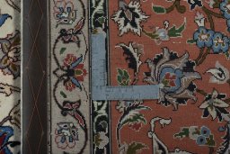 Backside of handmade New Tabriz 50/60/70 Raj rug showing knot structure and weave density