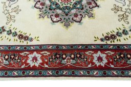 Corner detail of 2000s Tabriz 50/60/70 Raj rug showing border pattern and Cork pile