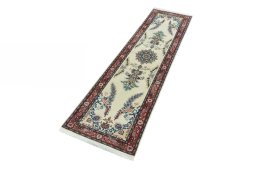 Corner detail of 2000s Tabriz 50/60/70 Raj rug showing border pattern and Cork pile