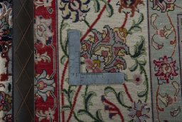Backside of handmade New Tabriz 50/60/70 Raj rug showing knot structure and weave density