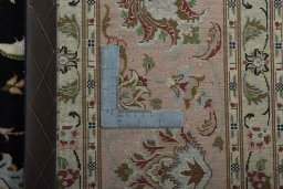 Backside of handmade New Tabriz 50/60/70 Raj rug showing knot structure and weave density