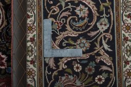 Backside of handmade New Tabriz 50/60/70 Raj rug showing knot structure and weave density