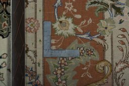 Backside of handmade New Tabriz 50/60/70 Raj rug showing knot structure and weave density