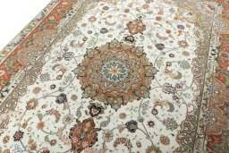 Backside of handmade New Tabriz 50/60/70 Raj rug showing knot structure and weave density