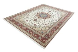 Corner detail of 2000s Tabriz 50/60/70 Raj rug showing border pattern and Cork pile