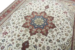 Backside of handmade 2000s Tabriz 50/60/70 Raj rug showing knot structure and weave density
