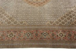 Corner detail of 2000s Tabriz 50/60/70 Raj rug showing border pattern and Cork pile