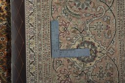 Backside of handmade 2000s Tabriz 50/60/70 Raj rug showing knot structure and weave density