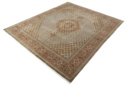 Corner detail of 2000s Tabriz 50/60/70 Raj rug showing border pattern and Cork pile