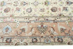 Corner detail of 2000s Tabriz 50/60/70 Raj rug showing border pattern and Cork pile