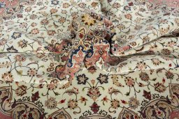 Corner detail of 2000s Tabriz 50/60/70 Raj rug showing border pattern and Cork pile