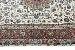 Corner detail of 2000s Tabriz 50/60/70 Raj rug showing border pattern and Cork pile