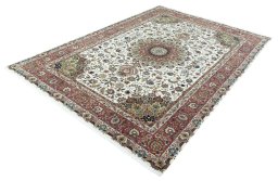 Corner detail of 2000s Tabriz 50/60/70 Raj rug showing border pattern and Cork pile