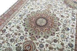 Backside of handmade 2000s Tabriz 50/60/70 Raj rug showing knot structure and weave density
