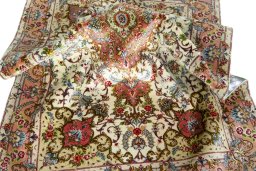 Backside of handmade New Tabriz 50/60/70 Raj rug showing knot structure and weave density