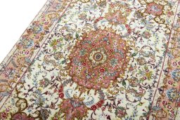 Backside of handmade New Tabriz 50/60/70 Raj rug showing knot structure and weave density