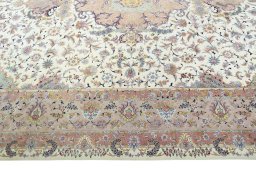 Corner detail of 2000s Tabriz 50/60/70 Raj rug showing border pattern and Cork pile