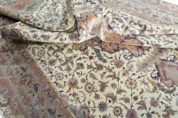 Surface texture of 2000s Tabriz 50/60/70 Raj rug with natural Cork and intricate pattern