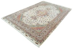Corner detail of 2000s Tabriz 50/60/70 Raj rug showing border pattern and Cork pile
