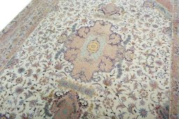Backside of handmade 2000s Tabriz 50/60/70 Raj rug showing knot structure and weave density