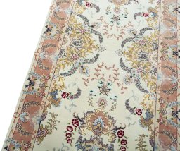 Backside of handmade New Tabriz 50/60/70 Raj rug showing knot structure and weave density